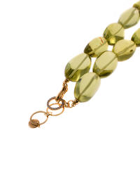 A necklace made of greenish amber
