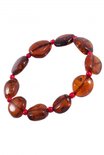 Bracelet made of amber stones-coins with beads