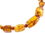 Amber beads with alternating figured stones and balls
