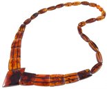 Beads with figured cognac-colored amber stones (with a diamond-shaped center)