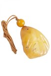 Pendant with relief stone and amber ball