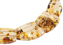 Beads made of figured translucent amber stones