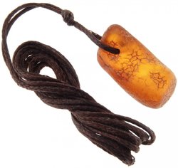 Healing pendant made of polished amber on a waxed thread
