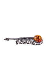 Silver brooch with amber “Violin”